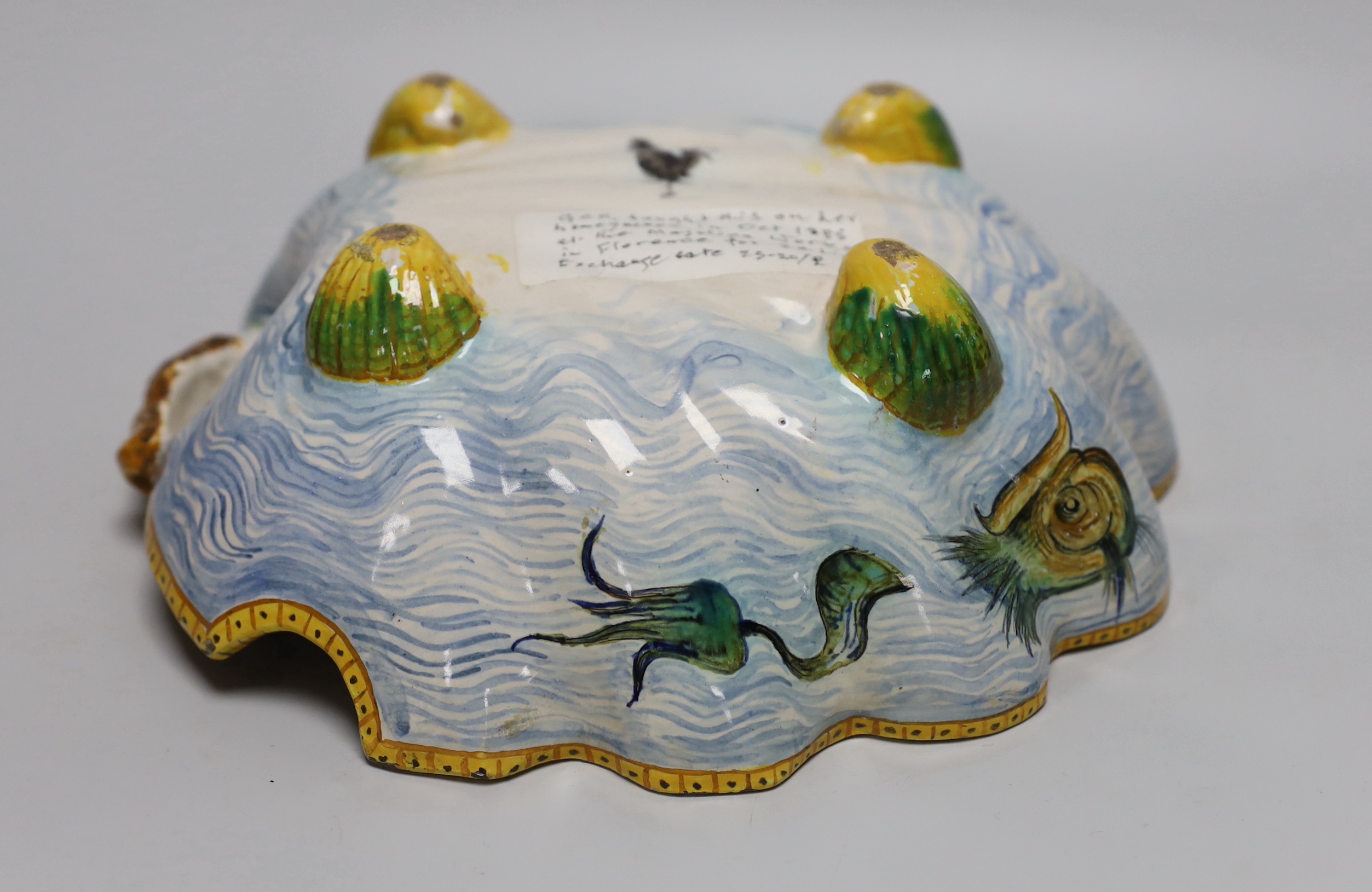 A late 19th/early 20th century Cantagalli maiolica scallop shell shaped dish, painted cockerel mark to base. 29cm long